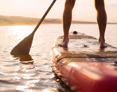 Person,On,Paddle,Board,At,Sunset